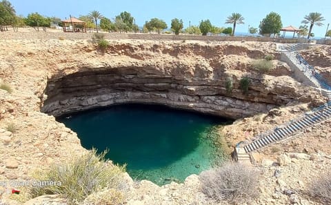 Full-Day Adventure Tour of Wadi Shab and Sinkhole in Muscat