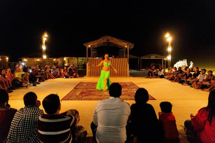 Travelers watch a belly-dancing show at a desert camp near Dubai.