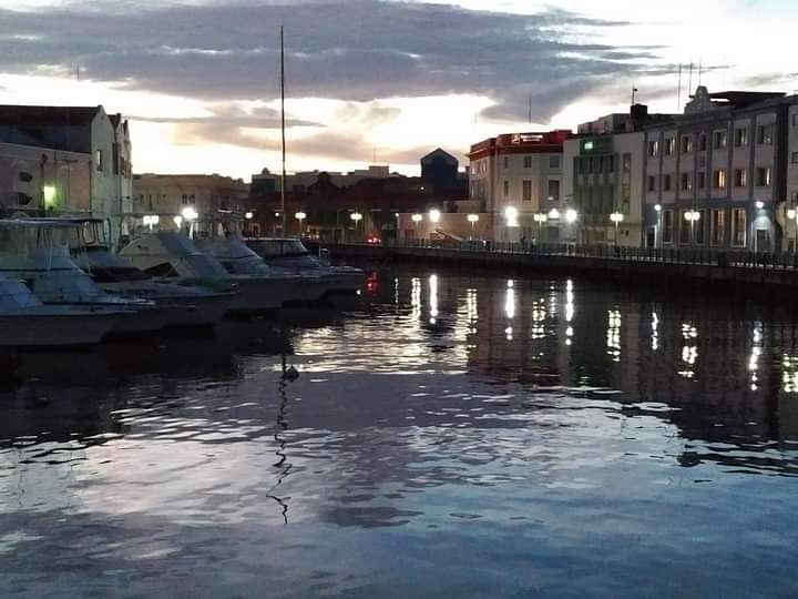 Careenage/Wharf at dusk, a scenic highlight of our guided history walking tour in Bridgetown.