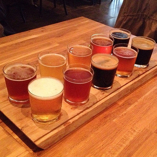 A sample platter with different types of beer displayed on it.