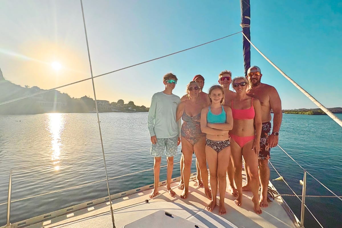 Family celebrating at sailing yacht in harbour with Maxie Sailing Curacao