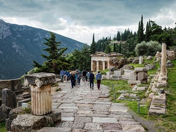 About 180 km northwest of Athens, at the foot of Mount Parnassos lies the sanctuary of Delphi which was regarded as the centre of the world in ancient Greece.