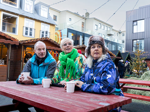 A tour group from Your Friend in Reykjavik enjoying a coffee together