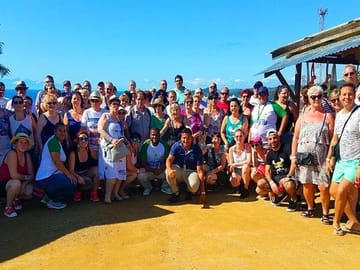 Our 100+ happy travelers at the Panoramic hill enjoying the sightseeing adventure in Roatan tropical island