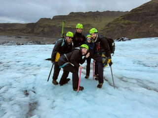 People making a silly photo on the glacier.