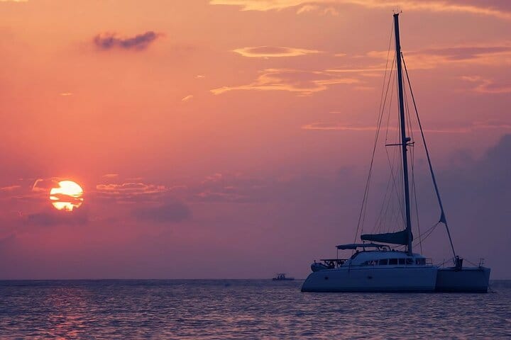 Indulge in a spectacular, private golden-hour experience as you sail through the fiery Pacific sunset aboard your luxury Costa Rica catamaran.
