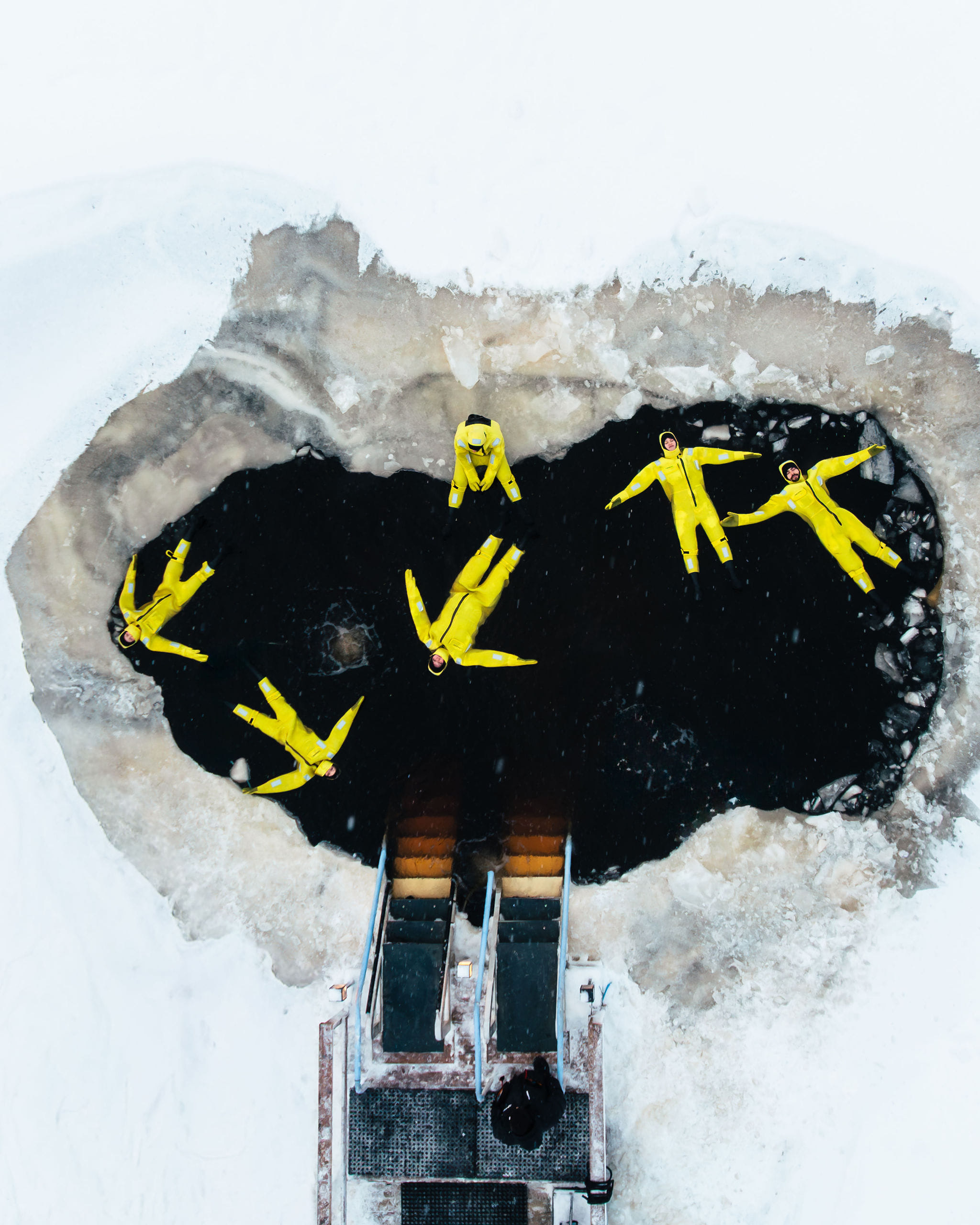 People floating in a frozen river