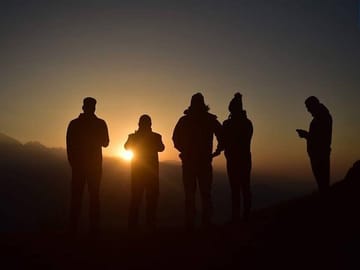 The sun goes down as the clock hits 5pm in the evening, on the outskirts of Kathmandu, Nepal.