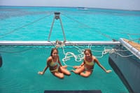 Relax on the bow trampoline with stunning views of the turquoise Caribbean sea