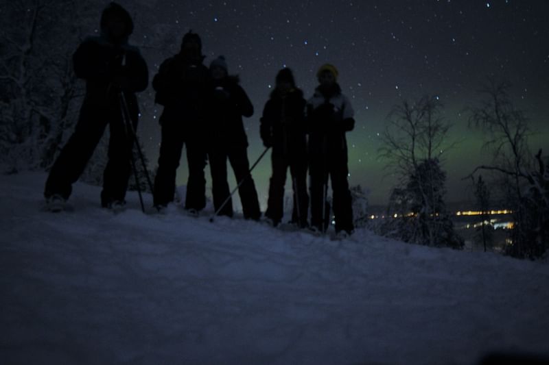 Northern lights snowshoeing Pyha-Luosto Kairankutsu Family
