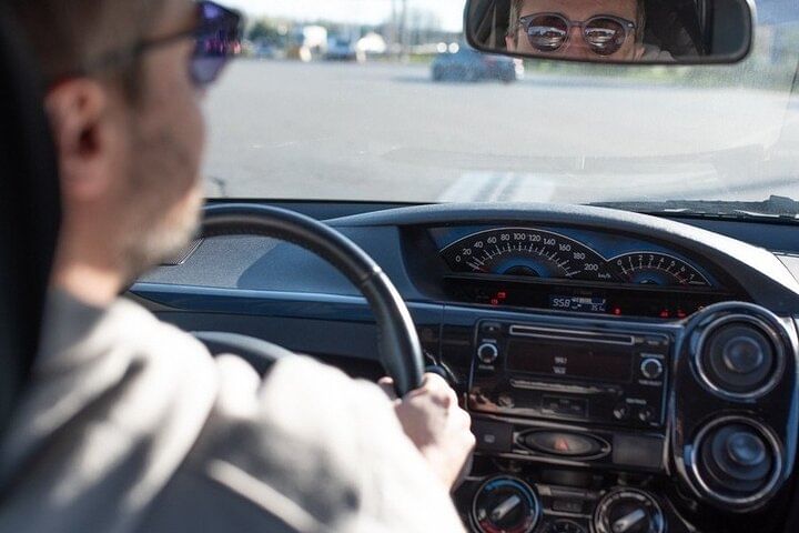 Professional driver behind the wheel ready to begin transfer service