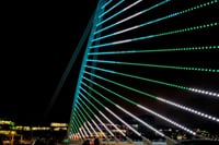 The Samuel Beckett Bridge illuminated at night this bridge resembles the Harp with its both shape