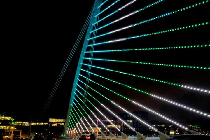 The Samuel Beckett Bridge illuminated at night this bridge resembles the Harp with its both shape