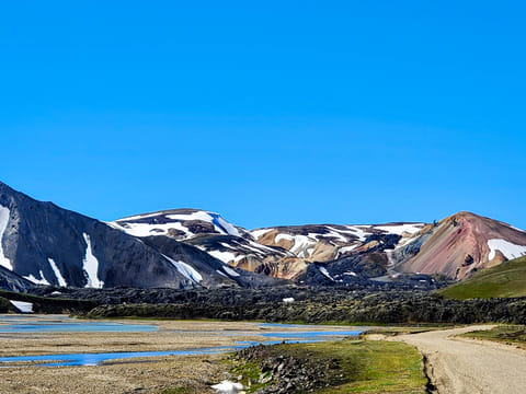 This is the view driving in to Landmannalaugar Bláhnúkur on the left Laugahraun in the middle and and Brennisteinsalda on the right