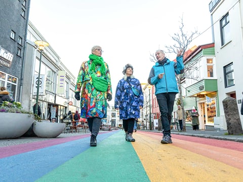 A picture of a tour group walking down the Rainbow Street in Reykjavik