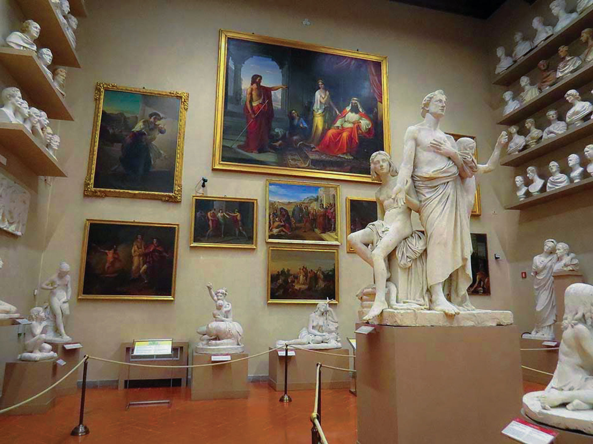 Sculptures and paintings on displays in one of the halls of Accademia Gallery 
