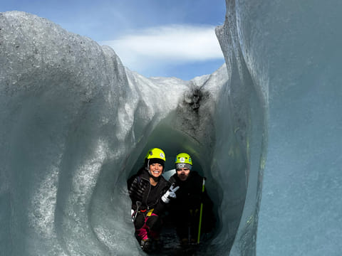 People in a crevasse for a cool photo on the glacier