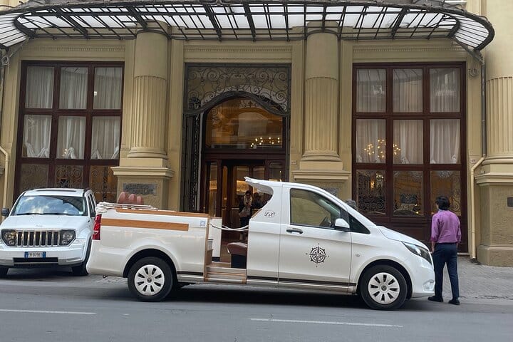 CruiserCar parked in front of the Grand Hotel de Les Palmes in Palermo, ready for a city tour