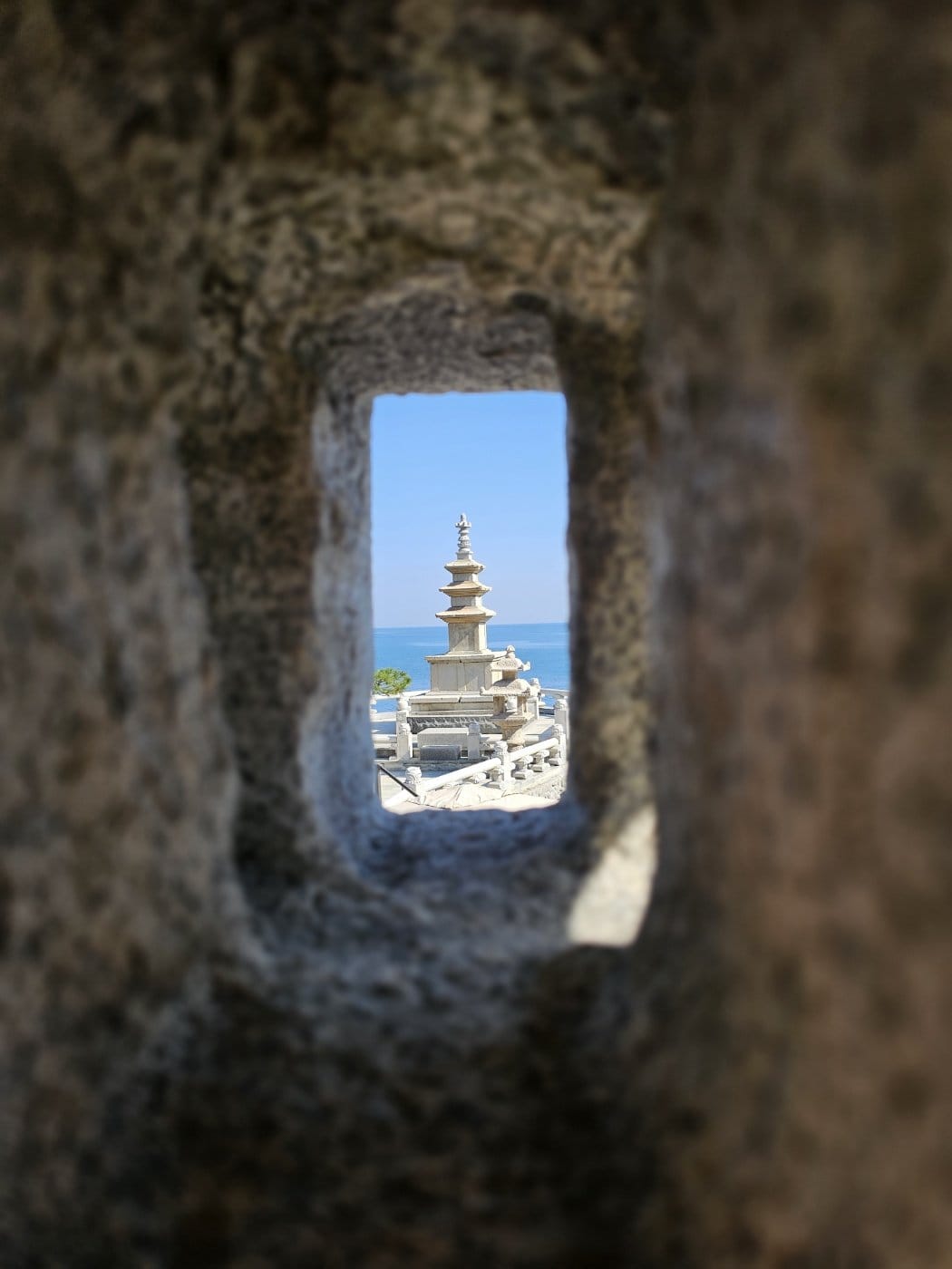 A multi-tiered stone pagoda standing at Haedong Yonggungsa Temple.