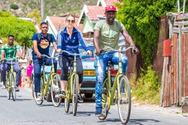 Pedal through Masiphumelele's energetic streets and meet locals on this captivating township bicycle tour.