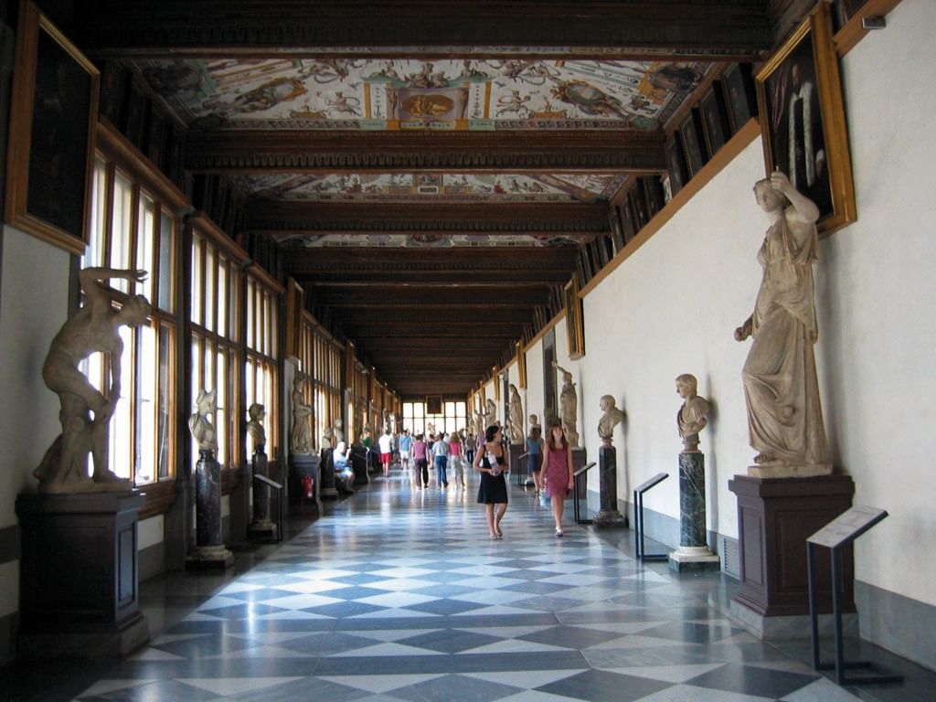 Corridor inside the Uffizi Gallery with sculptures on display 