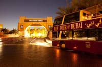 "Dubai's iconic skyline serves as the backdrop for tourists enjoying the Big Bus Tour, a fantastic way to explore."