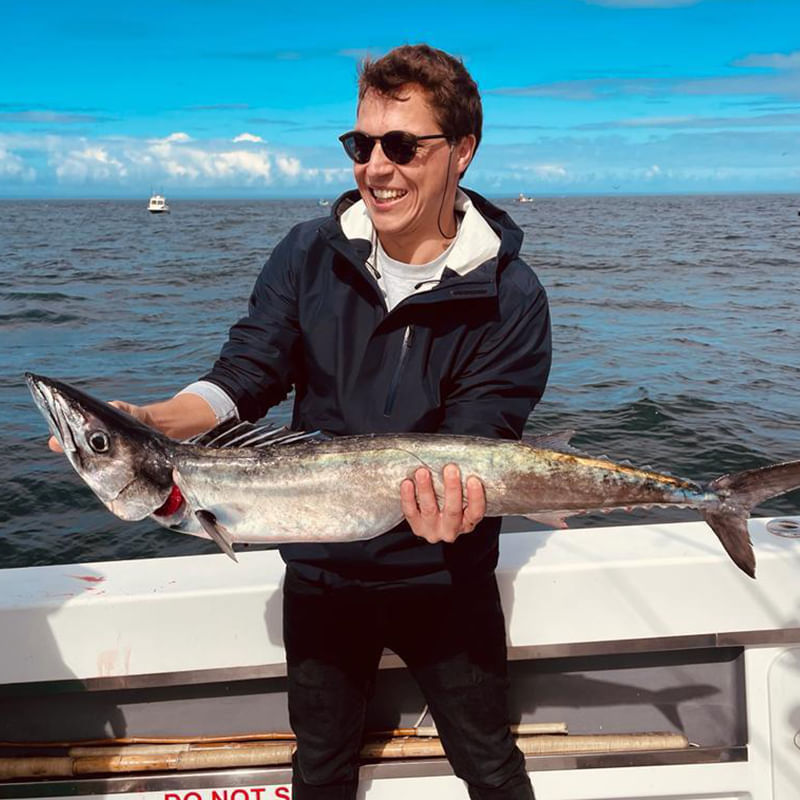 Celebrating the day's catch against the endless blue of False Bay.