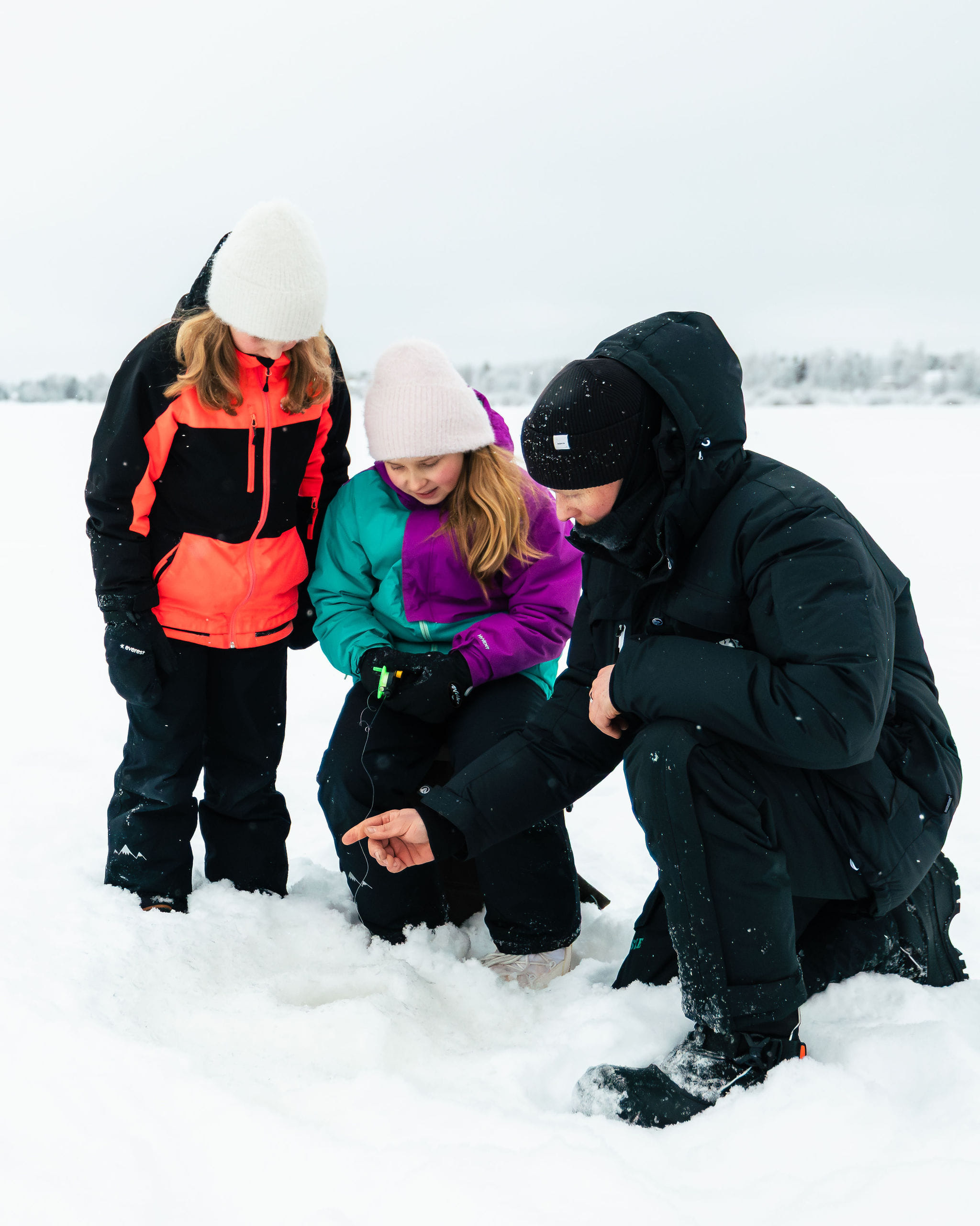 Kids ice fishing with local guide