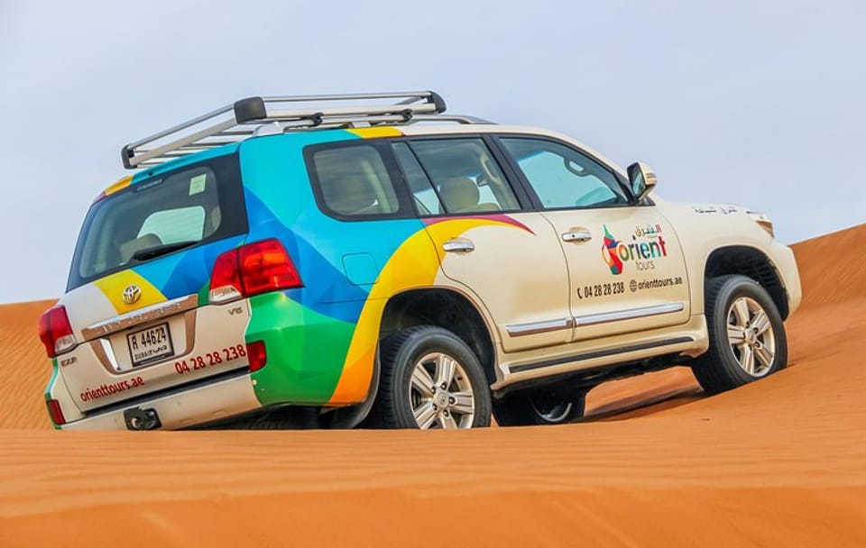 Morning Dubai Desert Safari with Camel Ride & Sand boarding