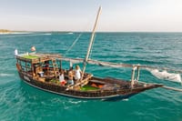Hop aboard a traditional Zanzibar boat, sail over turquoise waters, and enjoy a relaxing day surrounded by breathtaking ocean views.