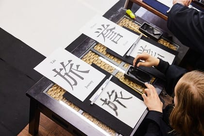 Learning Zen of Japanese Calligraphy in kimono near Osaka Castle