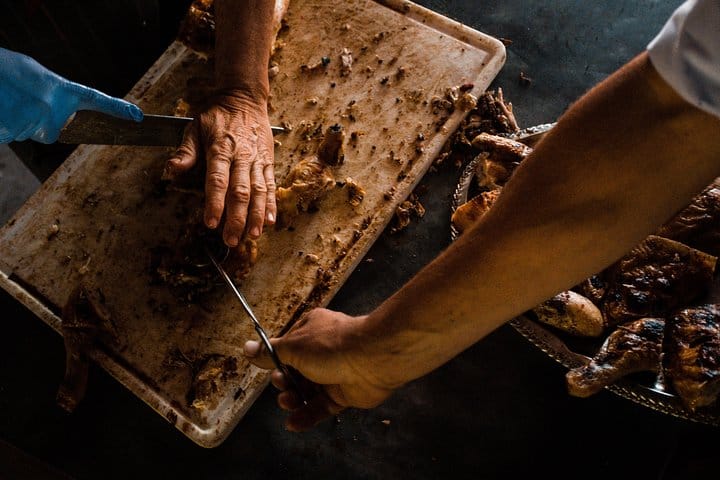 Gauchos preparing one of their specialties for visitors at the Estancia Santa Susana ranch.