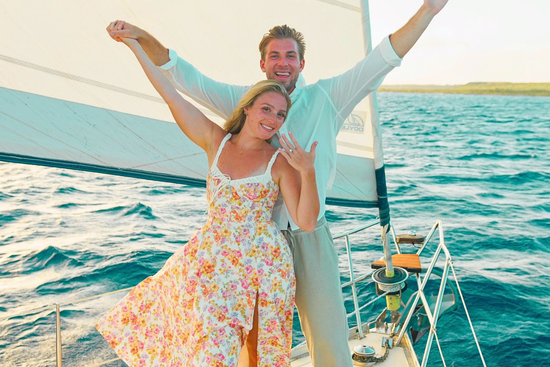 Romantic couple enjoying beautiful Caribbean sea on private yacht with Maxie Sailing