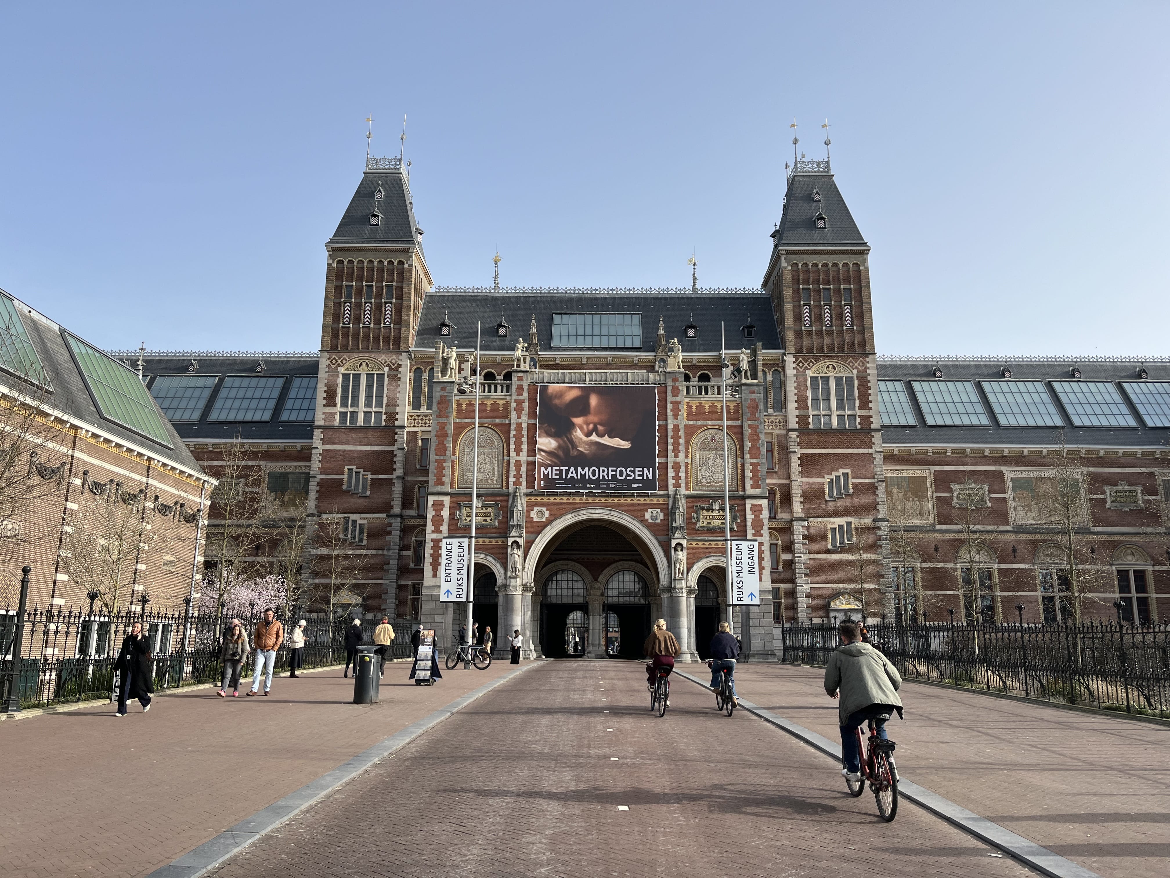 The Rijksmuseum building in Amsterdam, a large red-brick structure with towers and arches,