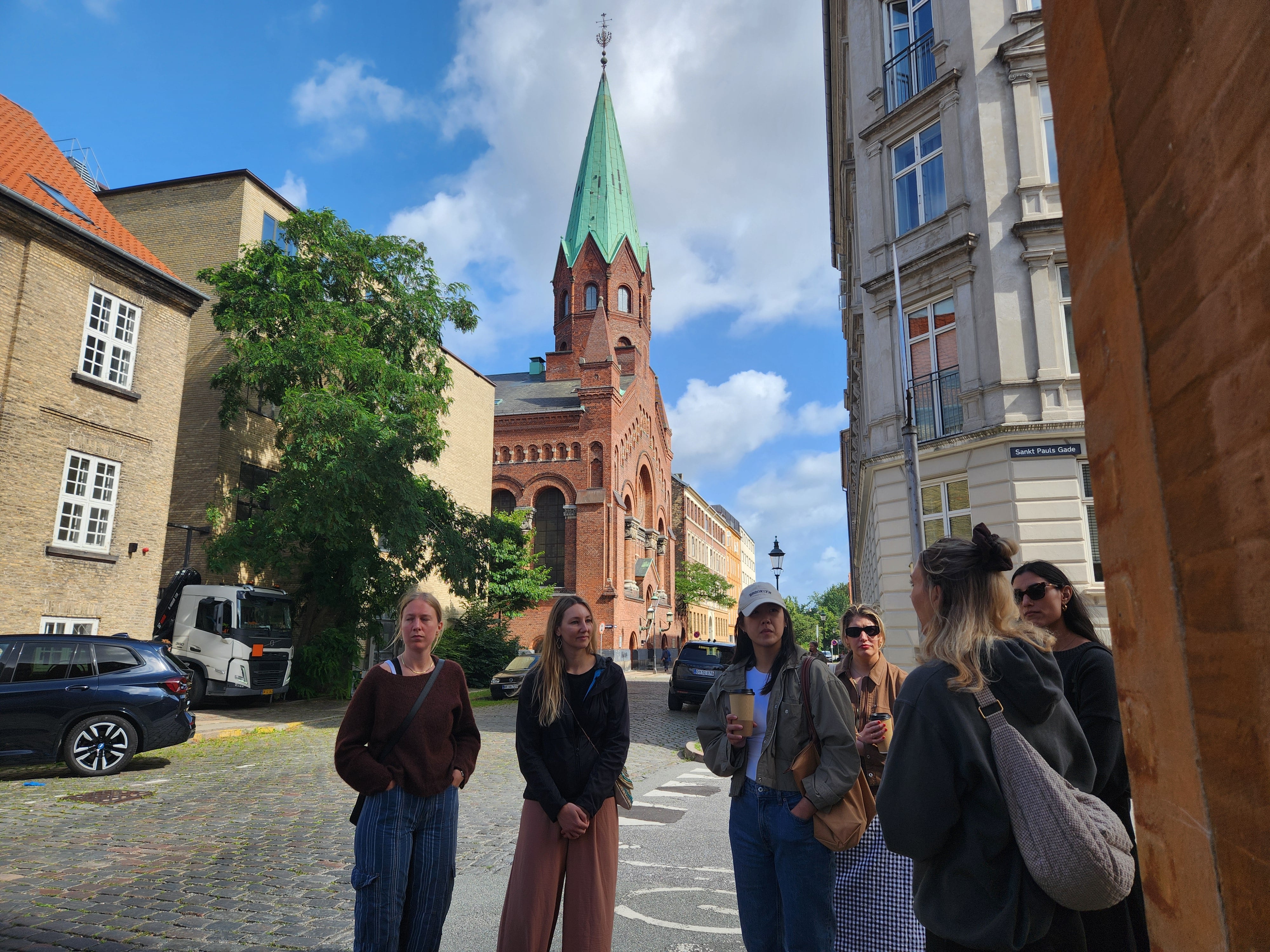 Local guide showing a walking tour group around Copenhagen highlights