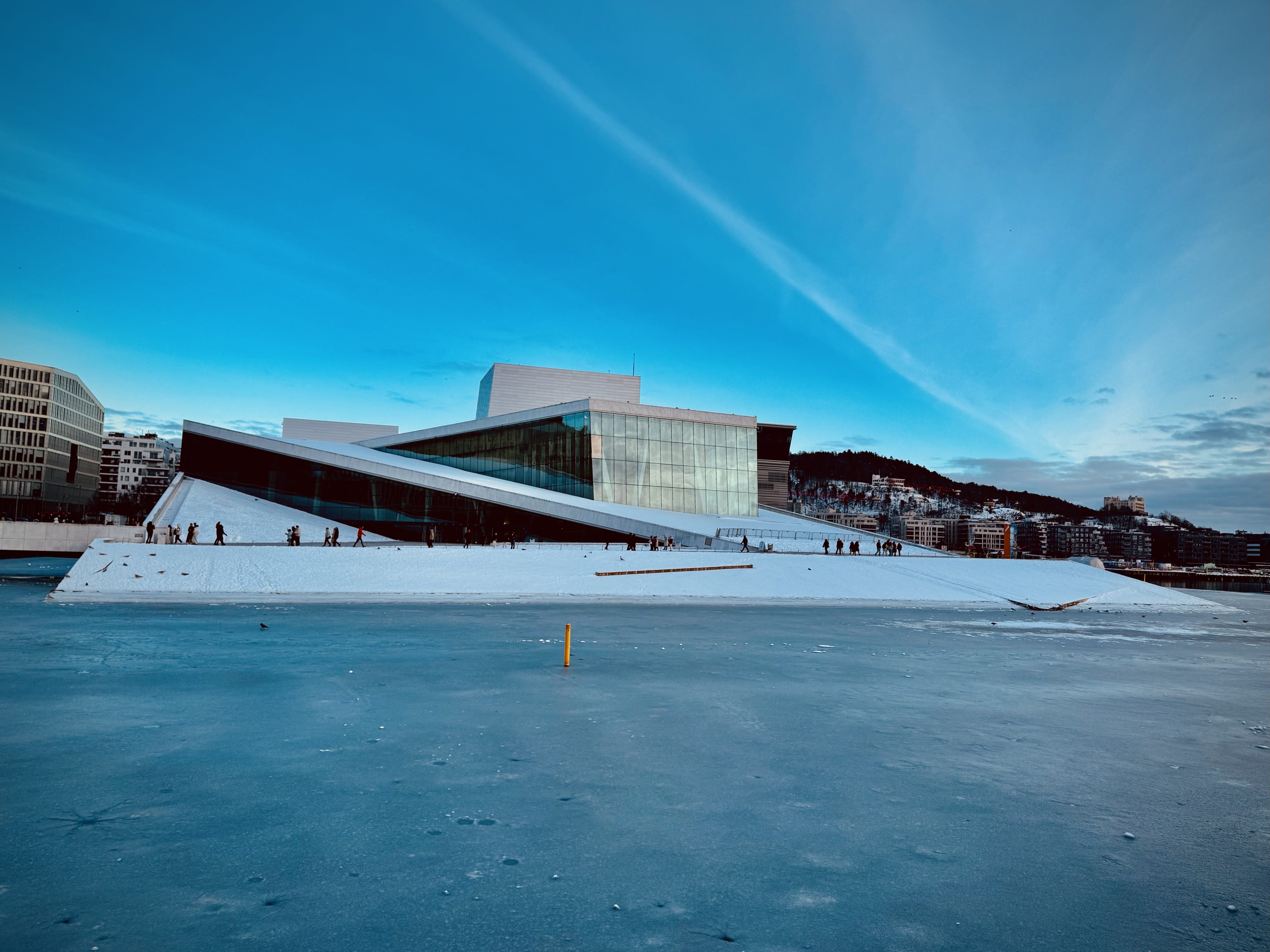 Opera in winter, with frozen water in front