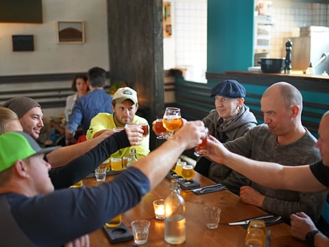 Travellers performing the cheers gesture after the the tour concludes.