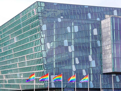The Harpa Concert Hall during Reykjavik Pride, showing rainbow flags in support of the LGBTQ Community