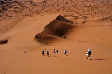 Desert Trekking Adventure with Sunset, Sunrise, and Sandboarding Experience