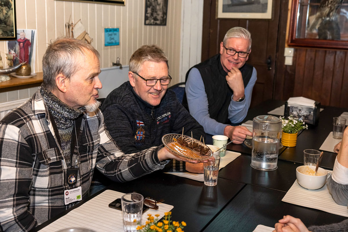The Guide from Your Friend in Reykjavik giving a closer explanation about the food the guests are consuming.