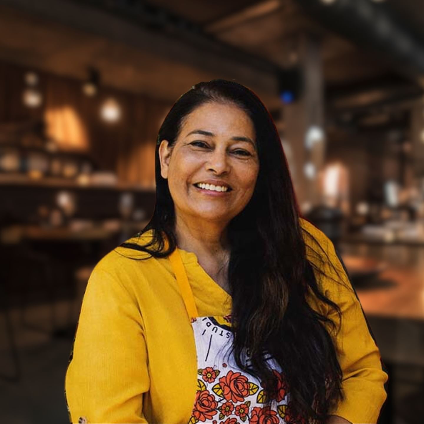 Chef Fayruza Abrahams (SPYCED Restaurant, Cape Town) presenting a dish to guests during the Gourmet Cape Malay Cooking Experience with Lunch