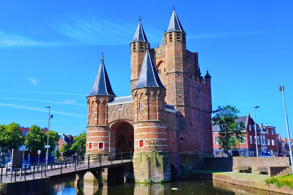 Canal-side view of Amsterdamse Poort along the route of the Haarlem scavenger hunt City Detective.