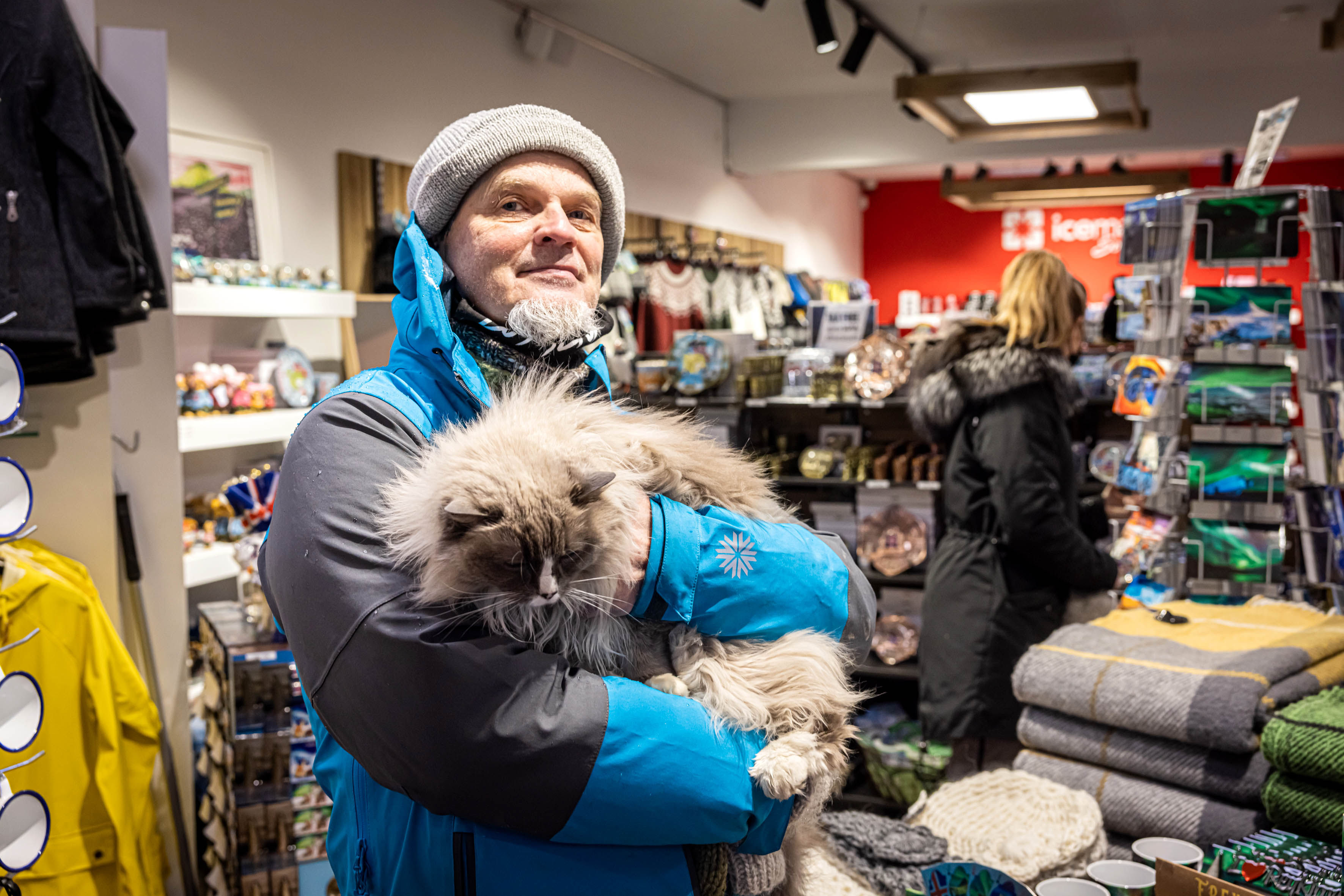 A guide from Your Friend in Reykjavik holding a cat in his arms.