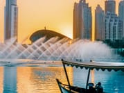 Evening view of the Dubai Fountains Show from the water.