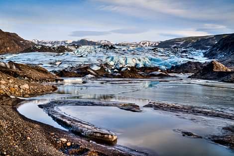 Glacier with water and sand lagoon