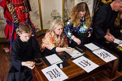 Learning Zen of Japanese Calligraphy in kimono near Osaka Castle
