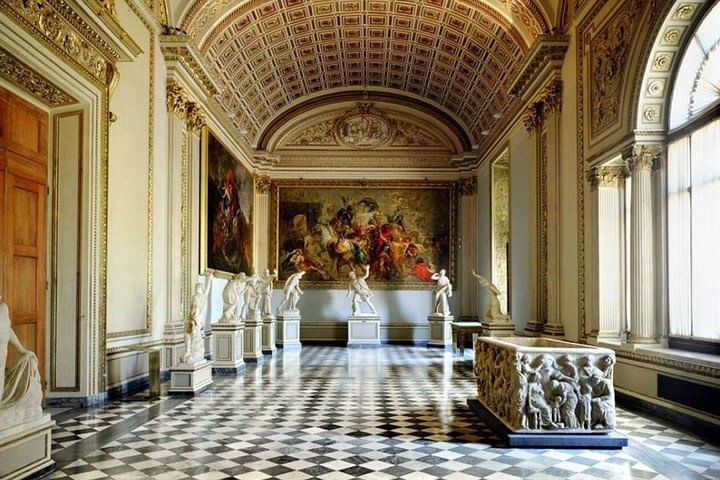 One of the corridors of the Uffizi Gallery, with paintings and sculptures on display 