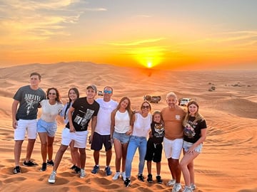 Morning Desert Safari with Camel Farm Visit & Sandboarding