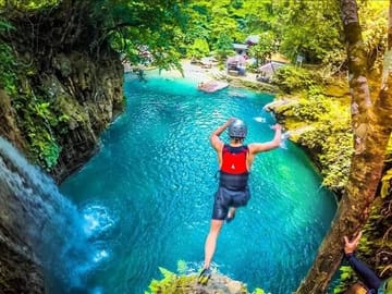 Feeling daring and brave as you rappel down rocky walls while exploring!