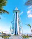 "Breathtaking exterior view of the Burj Al Arab under the Dubai skyline."